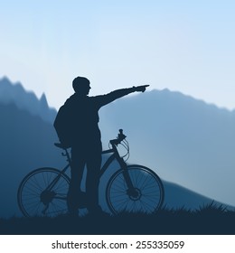 Cyclist shows the way in the mountains