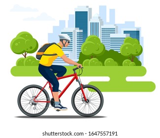 Cyclist side view in a helmet on a city background. Healthy lifestyle, environmentally friendly city transport.