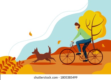 Cyclist-an athlete on a Bicycle. Man riding a bicycle in the Park with the dog. Autumn landscape with trees and leaves. 