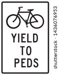 Cyclists yield to pedestrian sign