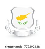 Cyprus flag in shield and ribbon. Vector illustration.