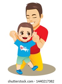 Dad helping baby boy son to walk first steps