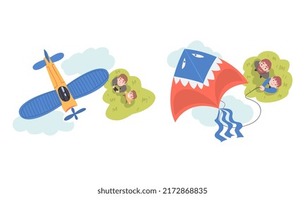 Dad and son launching aircraft model and kite outdoors. View from above of parents and children watching at flying aircrafts cartoon vector illustration