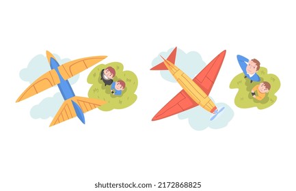 Dad and son launching aircraft models outdoors set. Top view of people watching at flying airplanes with smile cartoon vector illustration