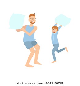 Dad And Son Pillow Fighting In Pajamas