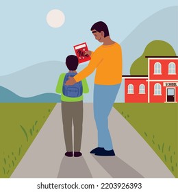 dad and son in the school with book