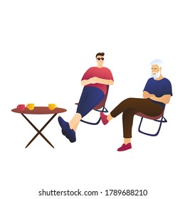 Dad and son are sitting at a table on a white background. Adults, family vacation concept.