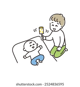 Papai acalma o bebê com um chocalho.