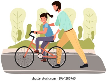 Dad teaches daughter to ride bike for first time. Father is helping girl kid to balance on bicycle. Parenting, fatherhood concept. Parent actively spends time with child outdoors. Family walk in park