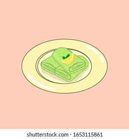 Dadar gulung, traditional indonesian snack with rolled sweet coconut pancake, and lemon garnish