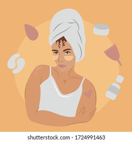 Daily care routine. Beautiful woman after shower in bath towel uses natural fresh orange slices as eye patches. Around her are beauty products such as: sponge, cream, menstrual cup, eye patches, oil. 