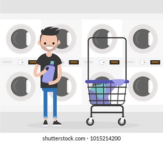 Daily routine. Young character washing clothes in a public coin laundry. Flat editable vector illustration, clip art