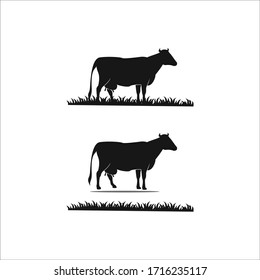 dairy cows silhouette and grass vector