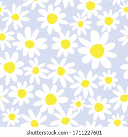 Daisy flower seamless pattern on blue background. Ditsy floral print.