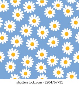 Daisy seamless pattern on blue background. Floral ditsy print with small white flowers and leaves. Chamomile design great for fashion fabric, trend textile and wallpaper. Vector