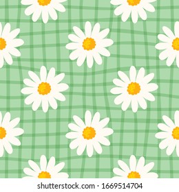 Daisy seamless pattern  on hand drawn checked background. Floral ditsy print with small white flowers and leaves. Chamomile trend design great for fashion fabric, kitchen textile and wallpaper. Vector