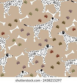 Dalmatian dog silhouette standing seamless pattern; cute dogs with bones and paw marks to print on accesories for dogs