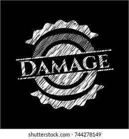 Damage chalkboard emblem written on a blackboard