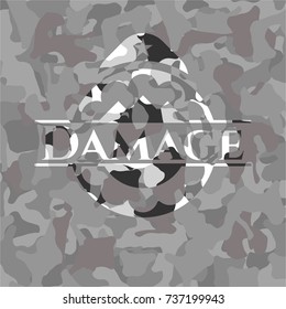 Damage written on a grey camouflage texture