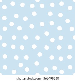 Damaged circles painted with a brush. Seamless pattern. White spots on a blue background. Repeating texture.