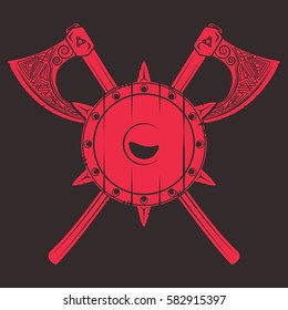 Damaged medieval shield with crossed axes. Vikings related t-shirt graphics and design elements. Vector vintage illustration.