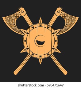 Damaged medieval shield with crossed axes. Vikings related t-shirt graphics and design elements. Vector vintage illustration.