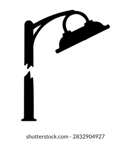 A damaged street lamp post with a bent arm and broken light fixture, situated on a city street, highlighting urban infrastructure issues.