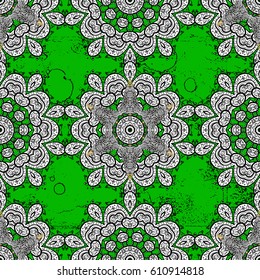 Damask pattern repeating background. Rough green floral ornament in baroque style. Antique white repeatable wallpaper. White element on green background.