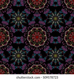 Damask seamless floral pattern in red and violet colors. Royal wallpaper. Abstract flowers on a black background. Vector stylish ornament.