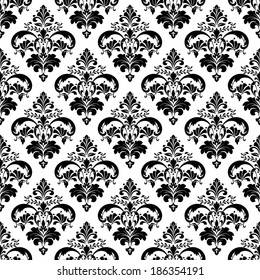 Damask seamless floral pattern. Royal wallpaper. Flowers on a black background.