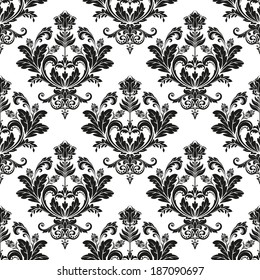 Damask seamless floral pattern. Royal wallpaper. Flowers on a black background.