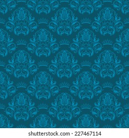 Damask seamless floral pattern. Royal wallpaper. Floral ornaments on a blue background. Vector illustration