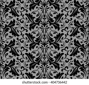 Damask seamless floral pattern. Royal wallpaper. Flowers on a black background. Luxurious vector ornament.