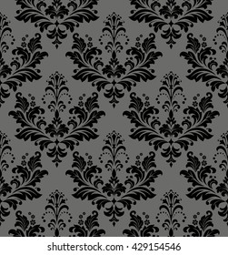 Damask seamless floral pattern. Royal wallpaper. Flowers on a black background. Luxurious vector ornament.
