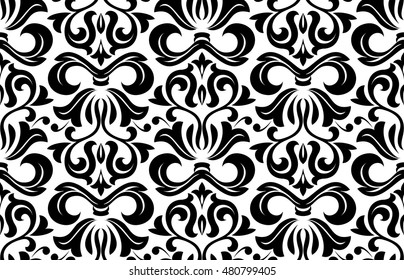 Damask seamless floral pattern. Royal wallpaper. Flowers on a black and white background. Graphic modern pattern.