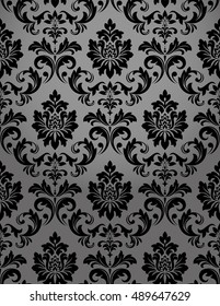 Damask seamless floral pattern. Royal wallpaper. Flowers on a black background. Stylish vector ornament.