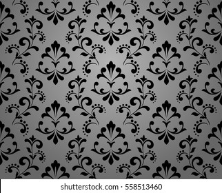 Damask seamless floral pattern. Royal wallpaper. Flowers on a black background. Stylish vector ornament.