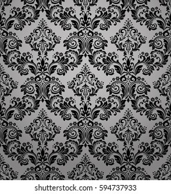 Damask seamless floral pattern. Royal wallpaper. Flowers on a black background. Luxurious vector ornament. Stylish graphic pattern