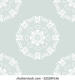 Damask seamless ornament. Traditional vector light blue and white pattern. Classic oriental background