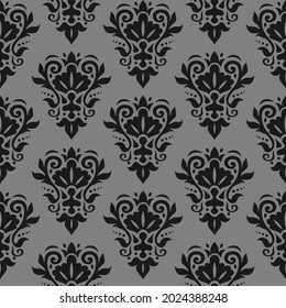 Damask seamless pattern. Decorative wallpaper. Damask trendy ornament. Black floral pattern on gray background. Vector texture.