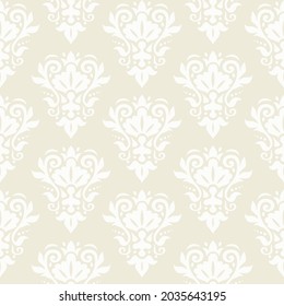 Damask seamless pattern. Decorative wallpaper. Damask trendy ornament. White floral ornament on a beige background. Vector texture.