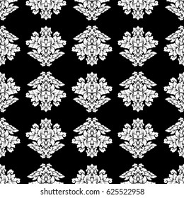 Damask seamless pattern intricate design. Luxury royal ornament, victorian texture for wallpapers, textile, wrapping. Exquisite floral baroque lacy flourish in black and white monochrome colors.