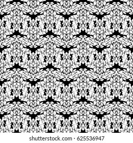 Damask seamless pattern intricate design. Luxury royal ornament, victorian texture for wallpapers, textile, wrapping. Exquisite floral baroque lacy flourish in black and white monochrome colors.