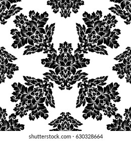 Damask seamless pattern intricate design. Luxury royal ornament, victorian texture for wallpapers, textile, wrapping. Exquisite floral baroque lacy flourish in black and white monochrome colors.