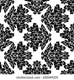 Damask seamless pattern intricate design. Luxury royal ornament, victorian texture for wallpapers, textile, wrapping. Exquisite floral baroque lacy flourish in black and white monochrome colors.