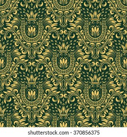 Damask seamless pattern repeating background. Gold green floral ornament with U letter and crown in baroque style. Antique golden repeatable wallpaper.