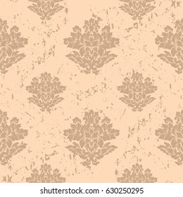 Damask seamless pattern with thin cracks and scratches. Luxury royal ornament with aged look, victorian texture for wallpapers, textile, wrapping. Exquisite floral baroque lacy foliage in beige color.