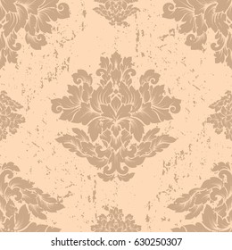 Damask seamless pattern with thin cracks and scratches. Luxury royal ornament with aged look, victorian texture for wallpapers, textile, wrapping. Exquisite floral baroque lacy foliage in beige color.