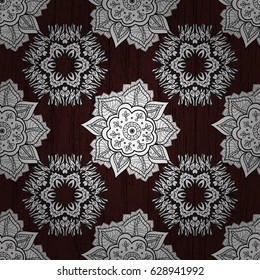 Damask seamless repeating pattern. Antique whiteen repeatable wallpaper. White element on brown background. White floral ornament in baroque style.