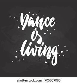 Dance is living - lettering dancing calligraphy quote drawn by ink in white color on the black chalkboard background. Fun hand drawn lettering inscription